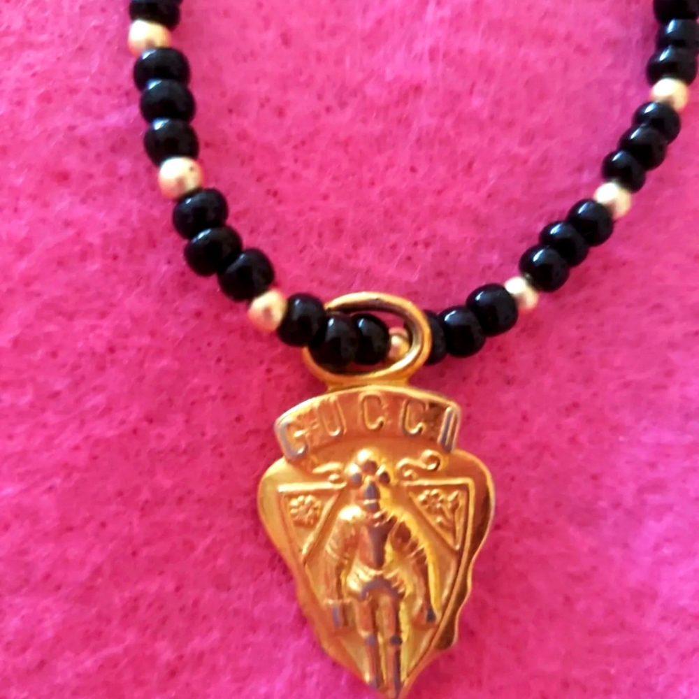 Gucci bag knight Crest charm 2 necklaces black & gold beaded and gt rope chain